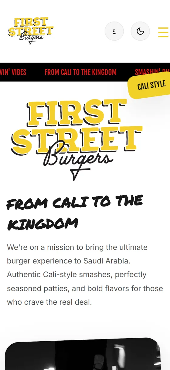 First Street Burgers Website — The English home page of the First Street Burgers site on a phone